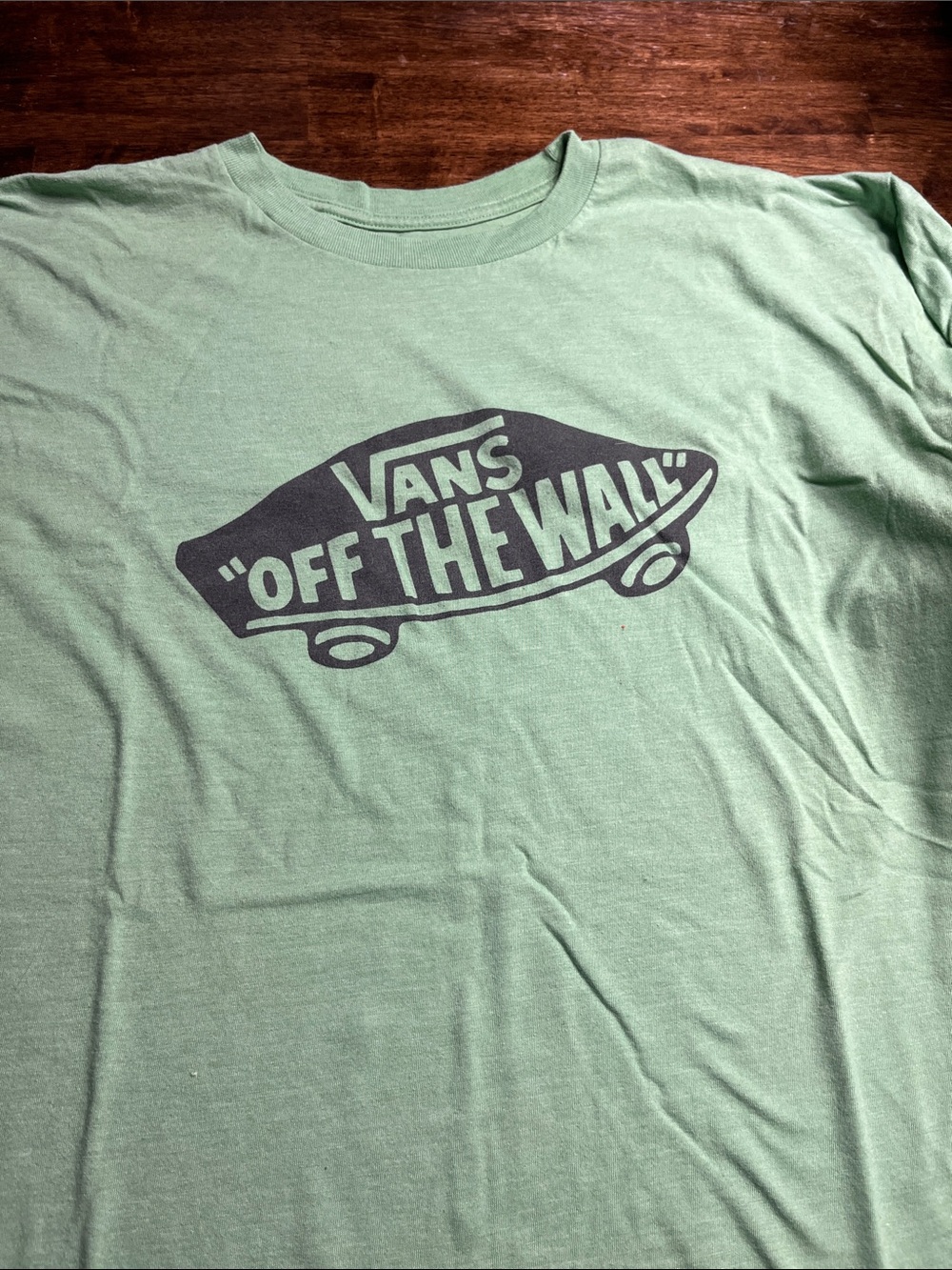 Vans sage green tee with dark navy Off The Wall logo